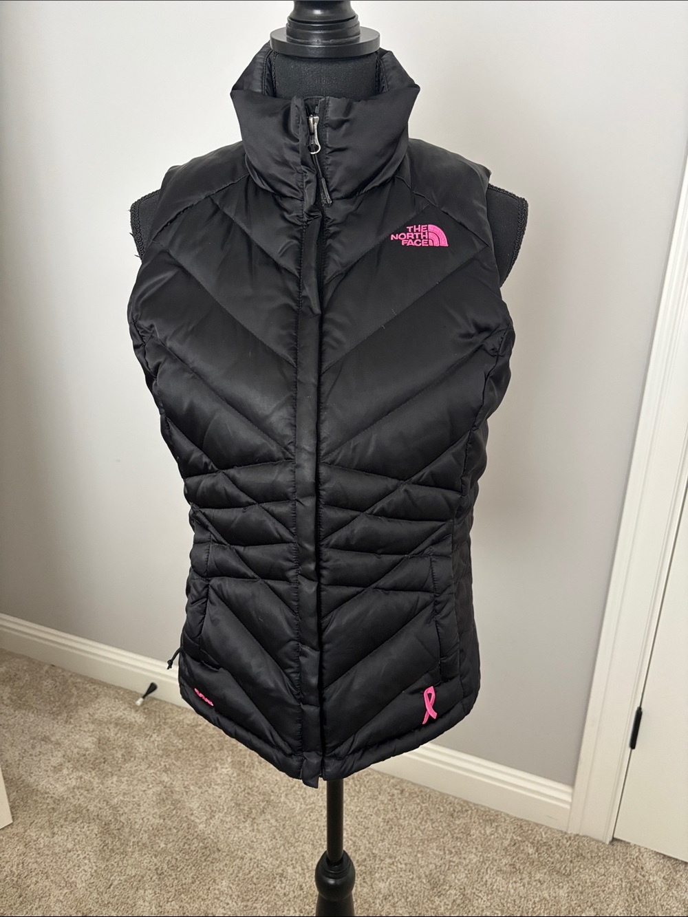 The North Face Black Puffer Vest with Pink Logo Accents